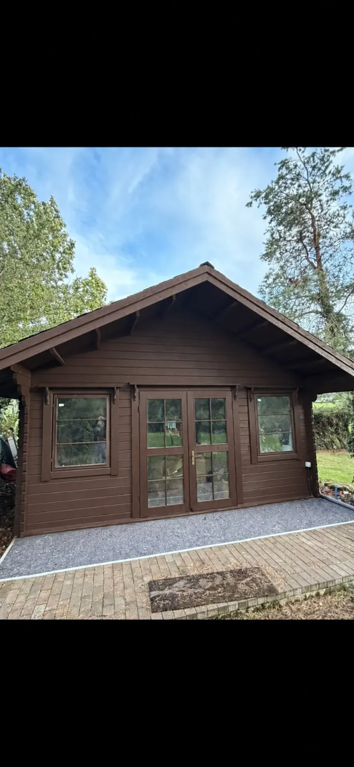 Front of the timber cabin — finish preview